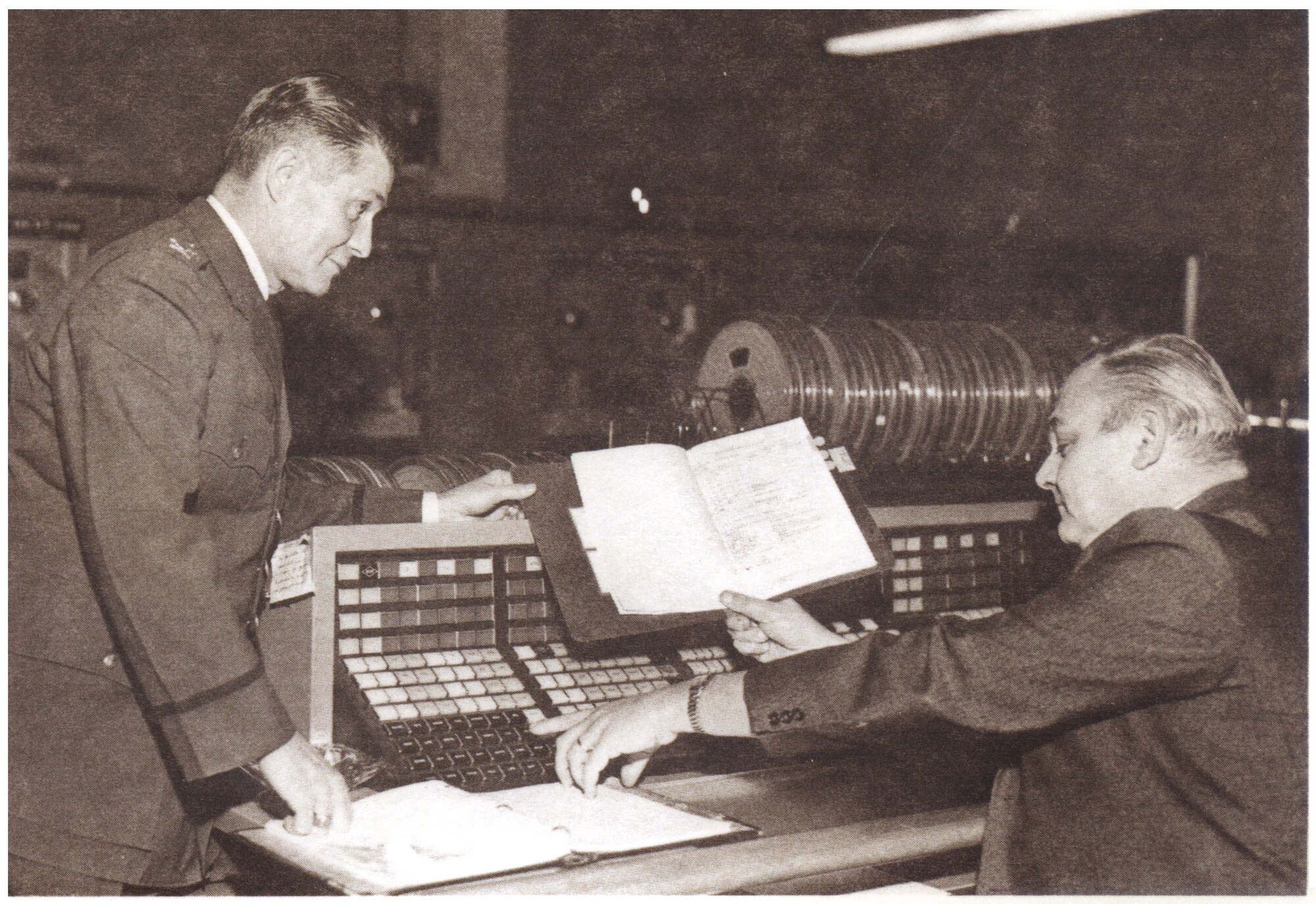 Col. Leland A. Walker, Jr., longest serving commander of ARPC, consulted with a staff member in the RCA 501 computer room during a 1968 mobilization at the York Street building in Denver.