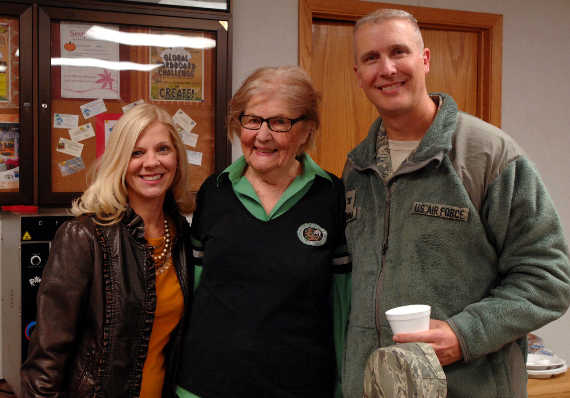 Grand Forks Herald columnist Marilyn Haggerty, center, visits with Col. Paul Bauman, 319th Air Base Wing commander, and his wife, Bonnie, at the Airman & Family Readiness Center’s Seventh Annual Soup Supper Oct. 24, 2013, on Grand Forks Air Force Base, N.D. Haggerty, who reviews restaurants in the Grand Forks area for the Herald, was invited as a special guest to this year's Soup Supper.  (U.S. Air Force photo/Staff Sgt. Susan L. Davis)