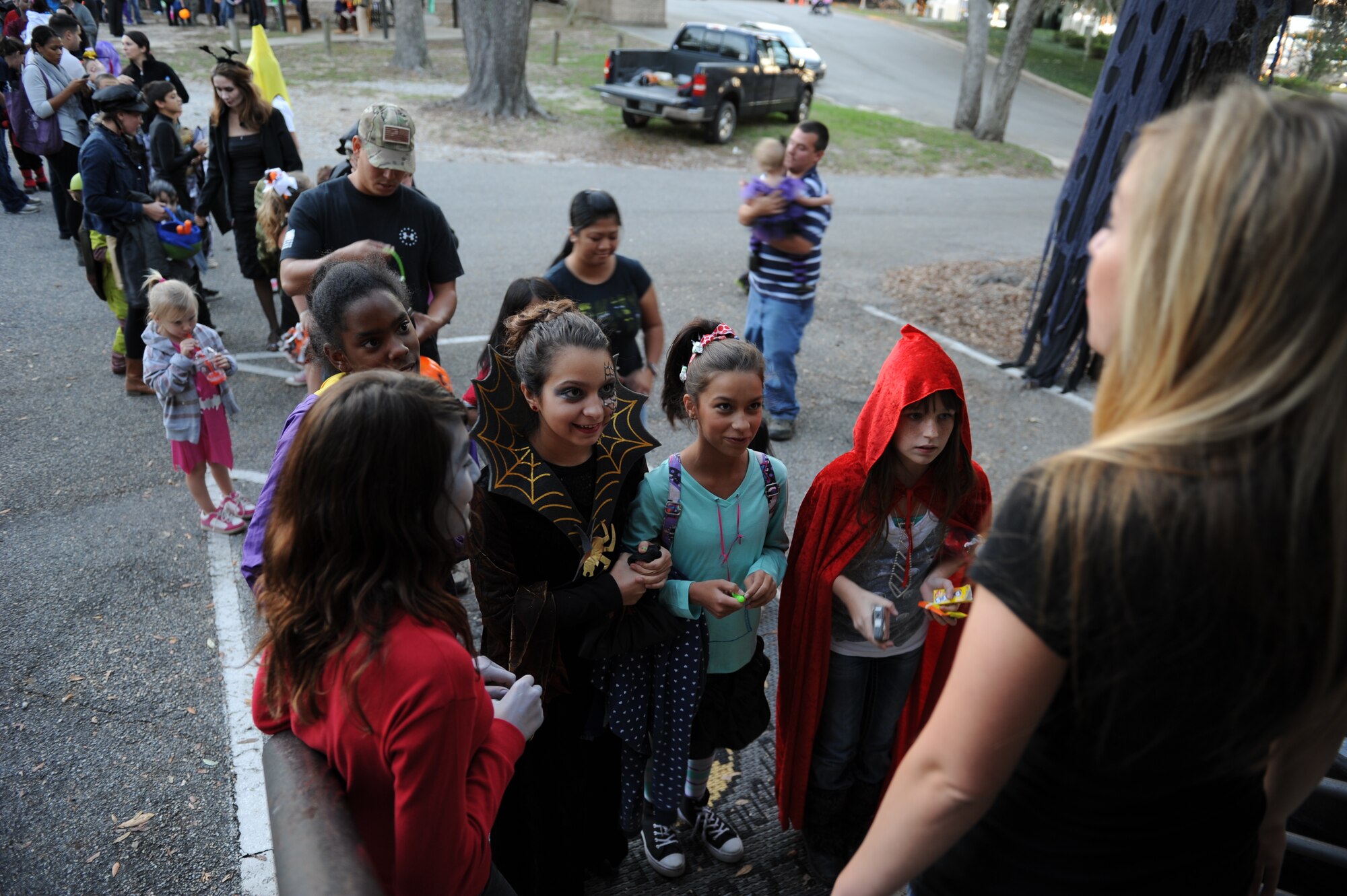 Keesler children wait in line for the Airman’s Council haunted house during the Ghouls in the Park event at the marina park Oct. 25, 2013, Keesler Air Force Base, Miss. The Airman’s Council provided an array of volunteers who lead tours, guided patrons, and dressed as monsters for the event. (U.S. Air Force photo by Airman 1st Class Stephan Coleman)