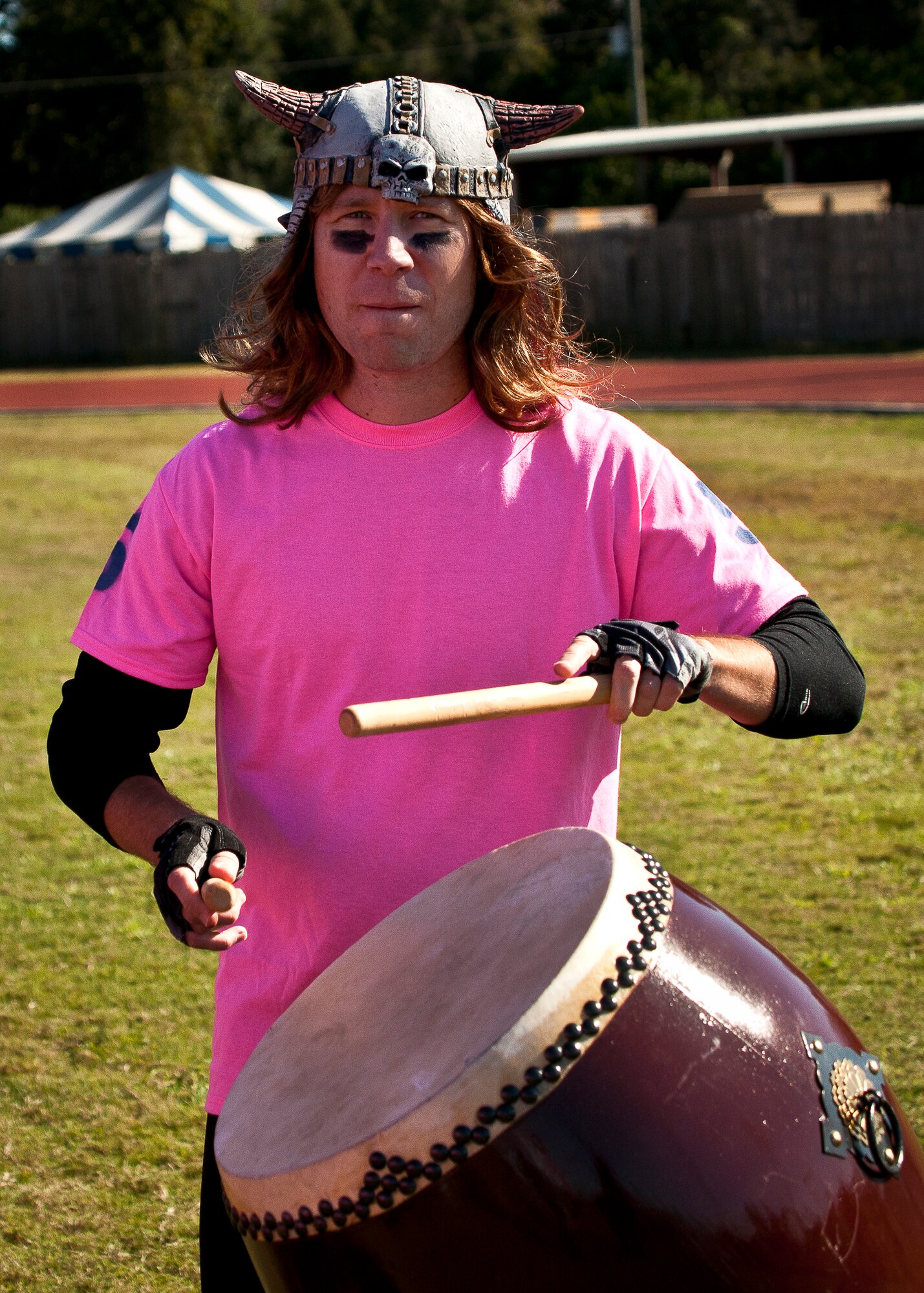 A 96th Logistics Readiness Squadron supporter bangs a drum in support of his powderpuff football team against the 96th Force Support Squadron during their game Oct. 25 at Eglin Air Force Base, Fla. LRS won the game 20-18. (U.S. Air Force photo/Samuel King Jr.)