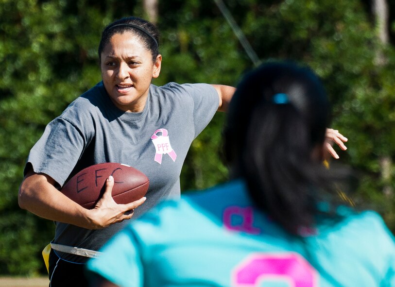 The 96th Force Support Squadron team’s quarterback darts for some extra yardage during their powderpuff football game against the 96th Logistics Readiness Squadron Oct. 25 at Eglin Air Force Base, Fla.  LRS won the game 20-18. (U.S. Air Force photo/Samuel King Jr.)