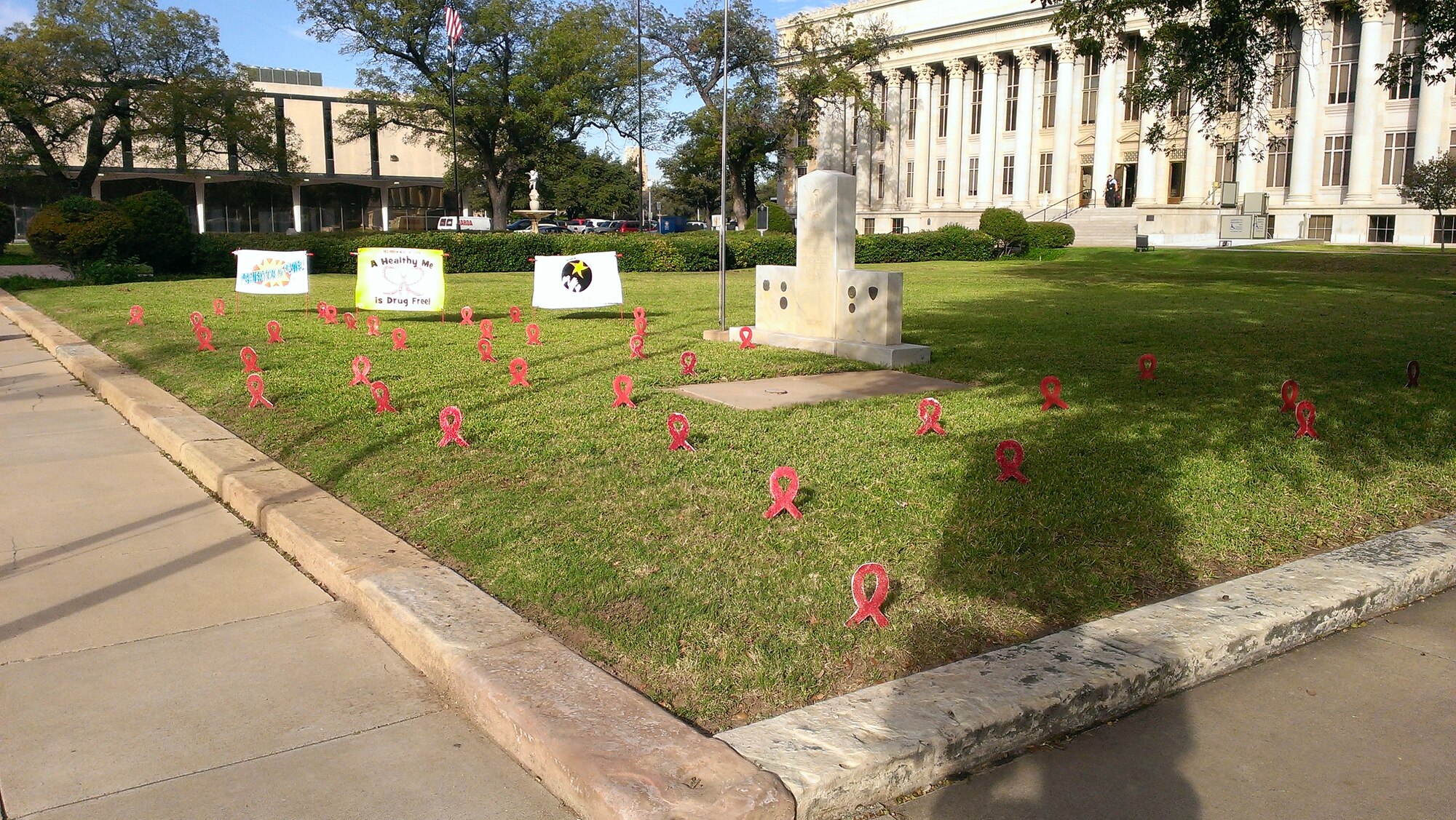 SAN ANGELO, Texas -- Red ribbons placed in front of the San Angelo Courthouse raise awareness for Red Ribbon Week Oct. 24. The Red Ribbon Campaign is now the oldest and largest drug prevention program in the nation, reaching millions of young people during Red Ribbon Week Oct. 23 to 31 each year. (Courtesy photo)