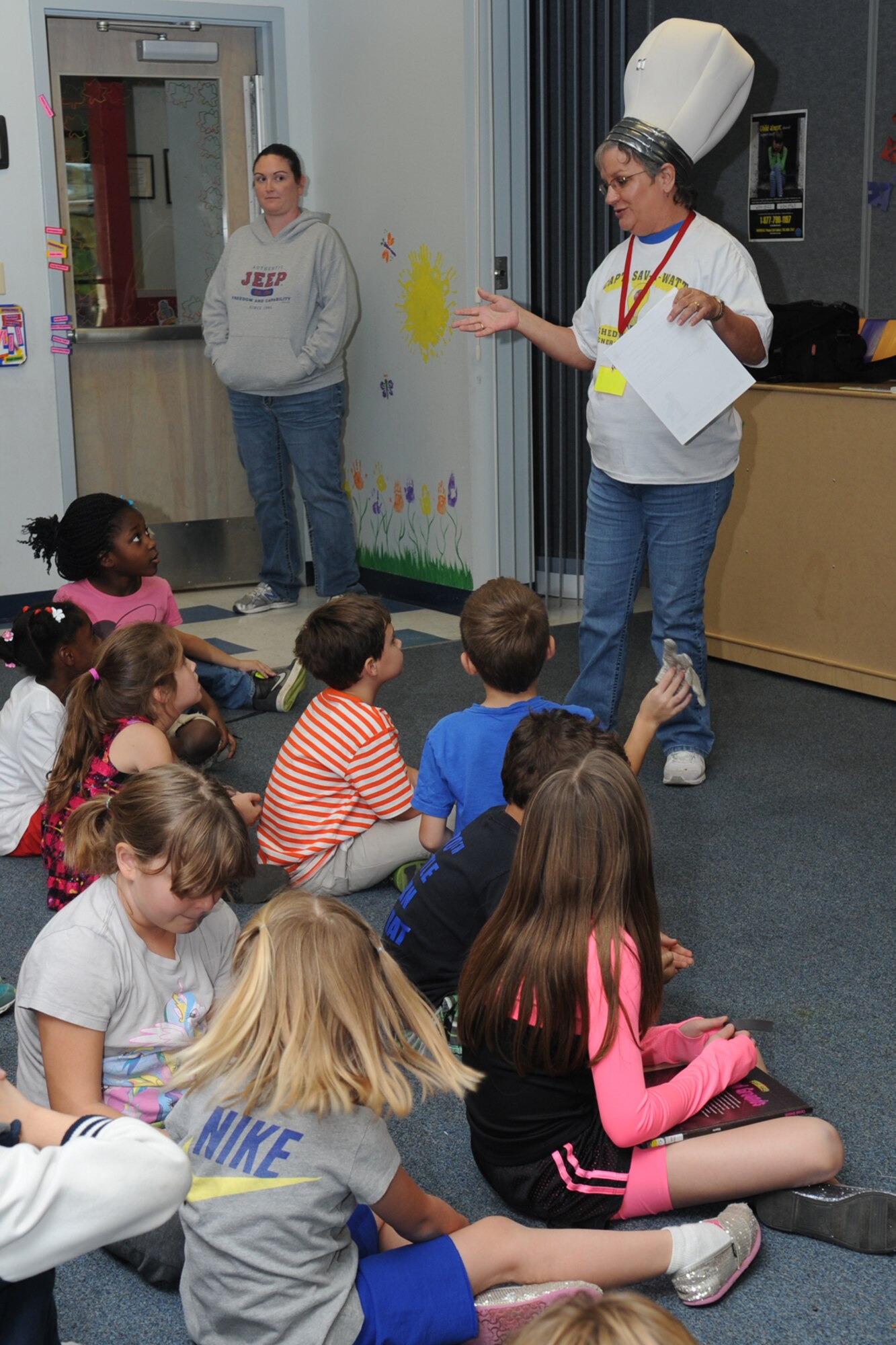 GOODFELLOW AIR FORCE BASE, Texas -- Mary Lumsdon, 17th Civil Engineer Squadron base energy manager, talks to children about energy conservation at the School Age Program Oct. 23. The children were taught ways in which they could help conserve energy such as turning off lights when not in a room and reminding their parents to do the same.  (U.S. Air Force photo/ Staff Sgt. Laura R. McFarlane)