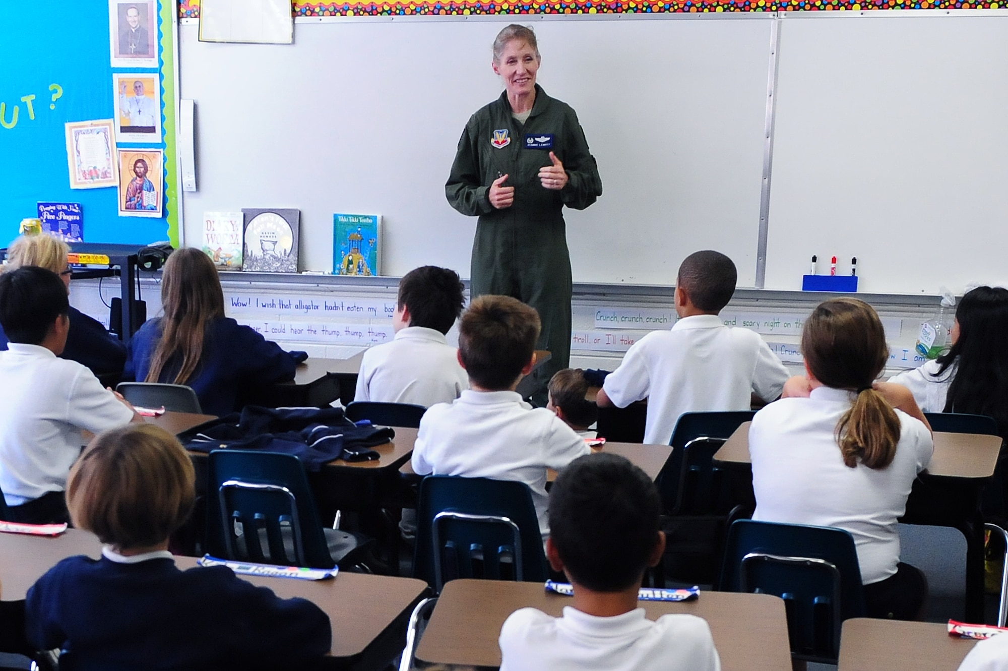U.S. Air Force Col. Jeannie Leavitt, 4th Fighter Wing commander, talks about her job during a career day event at St. Mary’s Catholic School in Goldsboro, N.C., Oct. 24, 2013.  Leavitt spoke with preschool and fourth graders and answered their questions about her experiences as a fighter pilot and the contributions of 4th FW Airmen.  (U.S. Air Force photo by Airman 1st Class Brittain Crolley)