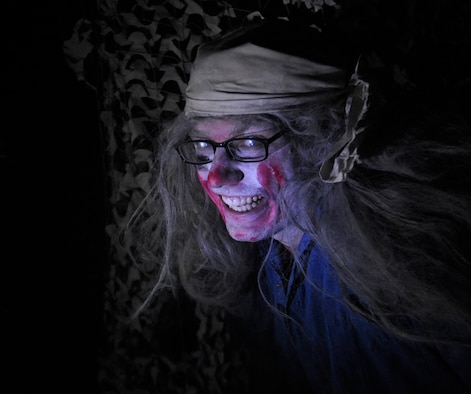 Members of Team Fairchild are brought through the haunted house hosted by the Survival School at Fairchild Air Force Base, Wash., Oct. 27, 2013. The event was held Oct. 25-27 at 6 – 9 p.m. (U.S. Air Force photo by Airman 1st Class Ryan Zeski)