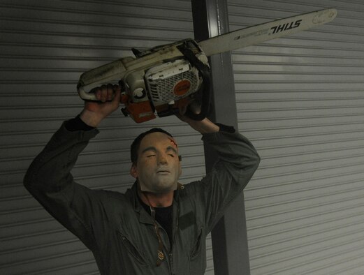 Members of Team Fairchild are brought through the haunted house hosted by the Survival School at Fairchild Air Force Base, Wash., Oct. 27, 2013. The event was held Oct. 25-27 at 6 – 9 p.m. (U.S. Air Force photo by Airman 1st Class Ryan Zeski)