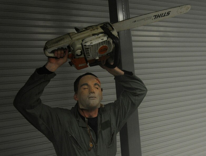 Members of Team Fairchild are brought through the haunted house hosted by the Survival School at Fairchild Air Force Base, Wash., Oct. 27, 2013. The event was held Oct. 25-27 at 6 – 9 p.m. (U.S. Air Force photo by Airman 1st Class Ryan Zeski)