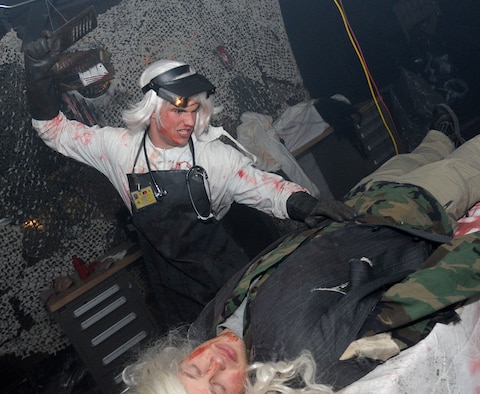 Members of Team Fairchild are brought through the haunted house hosted by the Survival School at Fairchild Air Force Base, Wash., Oct. 27, 2013. The event was held Oct. 25-27 at 6 – 9 p.m. (U.S. Air Force photo by Airman 1st Class Ryan Zeski)