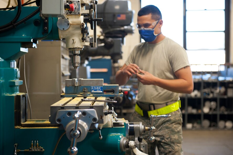 Airman 1st Class James Taber, 5th Maintenance Squadron aircraft metal technology apprentice, works on drilling new equipment, Oct. 24. Originally from Greenville, Tenn., Taber is part of a dedicated team of metals technicians here. (U.S. Air Force photo/Airman 1st Class Lauren Pitts)