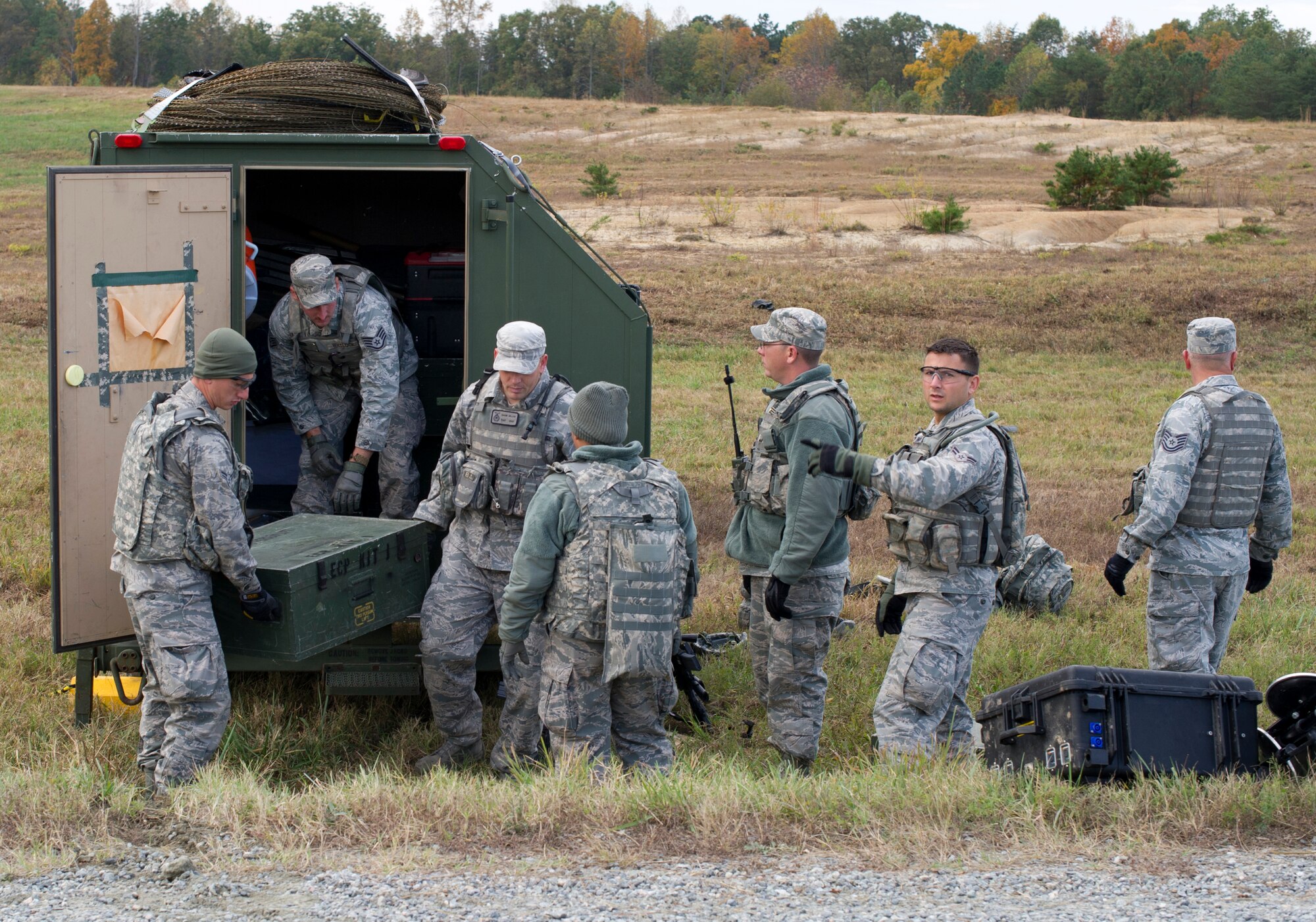 FORT A.P. HILL, Va. – Security forces members assigned to the 817th Contingency Response Group set up an entry control point during an exercise here, Oct. 22. The 817 CRG training focused on airfield operations, which included training for the assessment team, landing zone safety officer, and other unit type code training objectives. (U.S. Air Force photo by Staff Sgt. Gustavo Gonzalez)