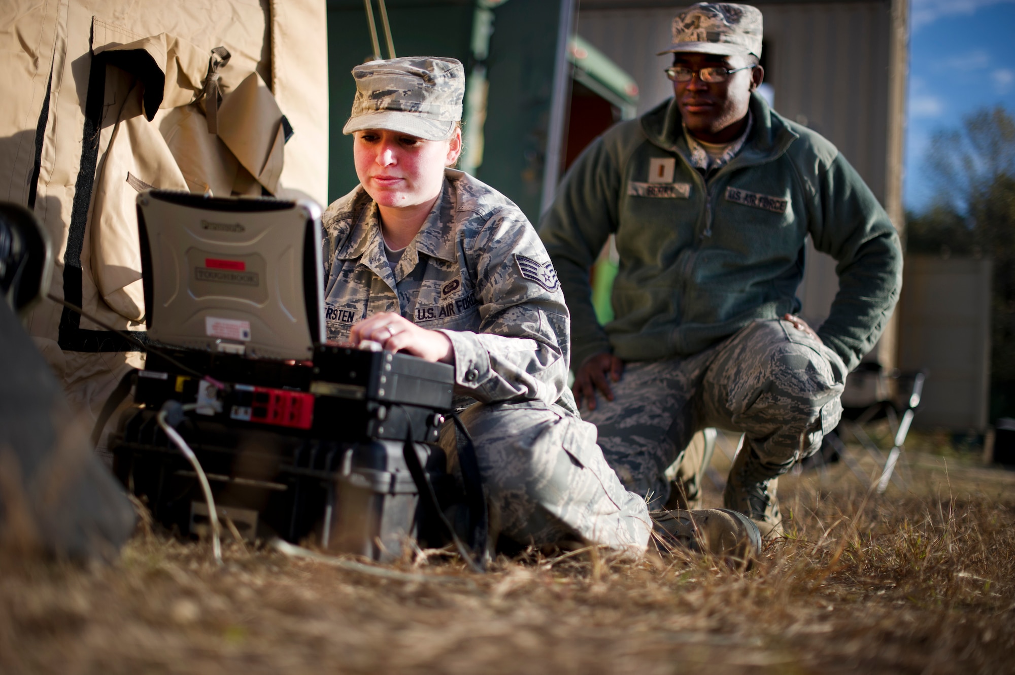 FORT A.P. HILL, Va. – Staff Sgt. Allisha Wennersten, 817th Contingency Response Group intel analyst, and 2nd Lt. David Berry, 817 CRG intel officer, attempt to connect to a satellite during an exercise here, Oct. 22. The 817th CRG training focused on airfield operations, which included training for the assessment team, landing zone safety officer, and other unit type code training objectives. (U.S. Air Force photo by Staff Sgt. Gustavo Gonzalez)