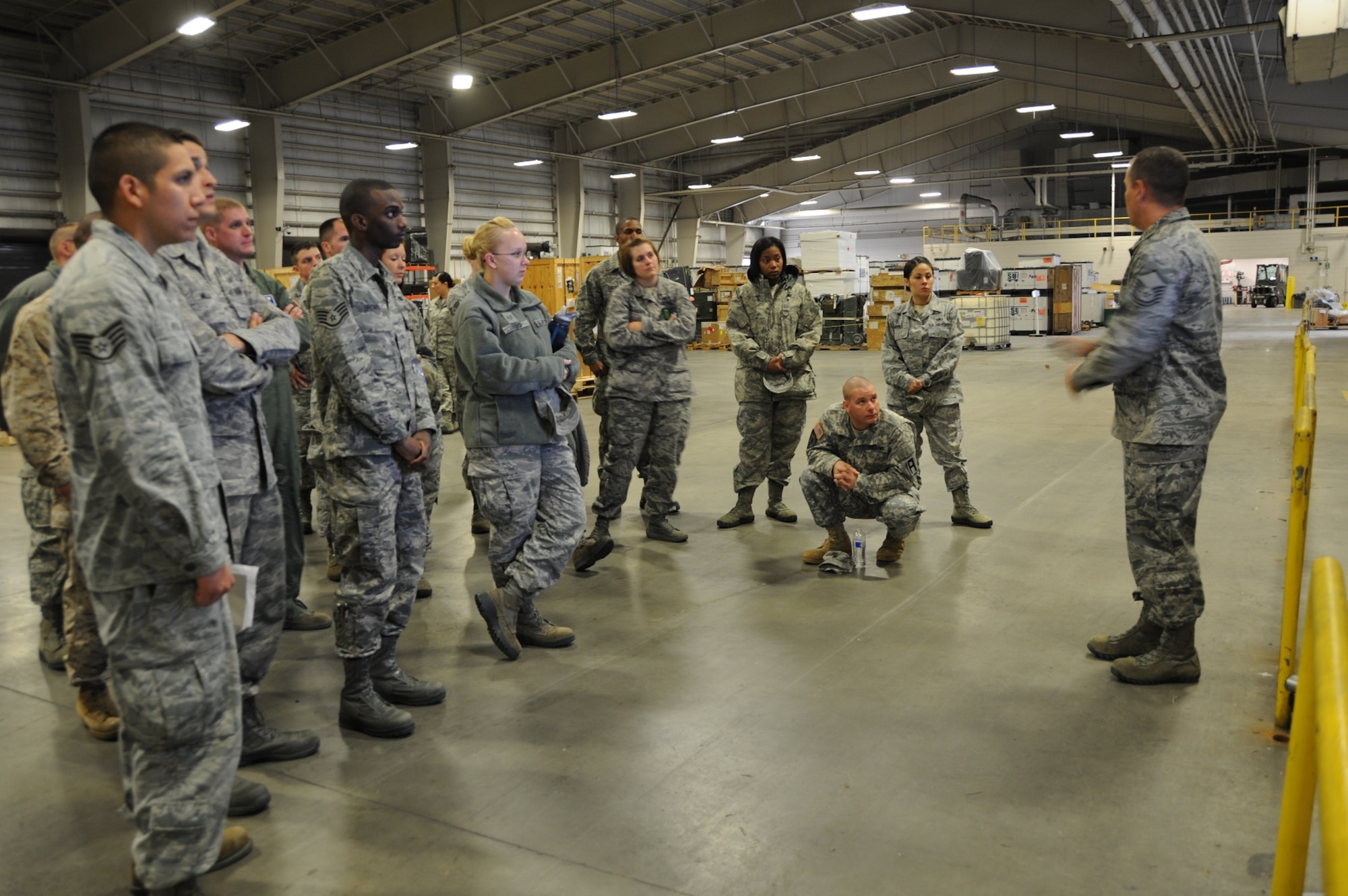 JOINT BASE MCGUIRE-DIX-LAKEHURST, NJ -- Joint Base McGuire-Dix-Lakehurst Leading Edge program participants receive a briefing inside a 305th Air Mobility Wing maintenance facility Oct. 23, 2013 at JB MDL, N.J.  (U.S. Air Force photo by Brad Camara/Released) 