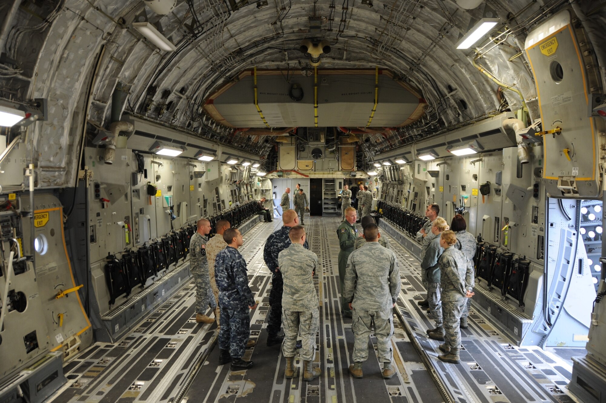 JOINT BASE MCGUIRE-DIX-LAKEHURST, NJ -- Joint Base McGuire-Dix-Lakehurst Leading Edge program participants receive a briefing inside a C-17 Globemaster III, Oct. 23, 2013, at JB MDL, N.J.  The participants toured the aircraft as part of a 305th Air Mobility Wing demonstration. (U.S. Air Force photo by Brad Camara/Released) 