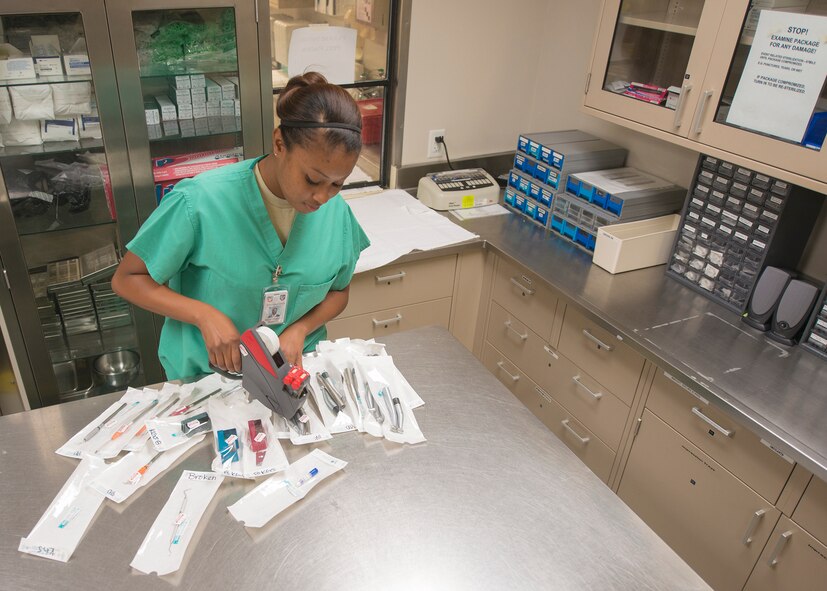 U.S. Air Force Airman 1st Class Kaelainn Slaughter, 23d Aerospace Medicine Squadron dental assistant, places date stamps on sterilized equipment at Moody Air Force Base, Ga., Sept. 30, 2013. The dental flight sterilizes all the tools used within the 23d Medical Group. (U.S. Air Force photo by Airman 1st Class Ryan Callaghan/Released)

