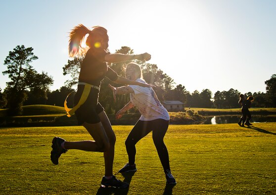 A runner fights back against a zombie trying to grab her flag during the 2nd Annual Zombie Run Oct. 26 at the Eglin Air Force Base golf course.  More than 500 people attempted to outrun zombies and maneuver through various obstacles along the four-mile course.  (U.S. Air Force photo/Samuel King Jr.)