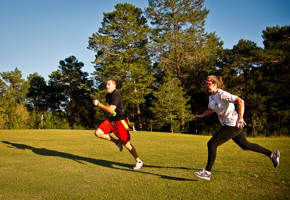 Zombies attack a runner midway through the 2nd Annual Zombie Run Oct. 26 at the Eglin Air Force Base golf course.  More than 500 people attempted to outrun zombies and maneuver through various obstacles along the four-mile course.  (U.S. Air Force photo/Samuel King Jr.)