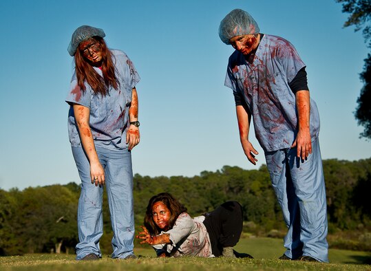 The zombie nurses were definitely not there to help the injured at the 2nd Annual Zombie Run Oct. 26 at the Eglin Air Force Base golf course.  More than 500 people attempted to outrun zombies and maneuver through various obstacles along the four-mile course.  (U.S. Air Force photo/Samuel King Jr.)