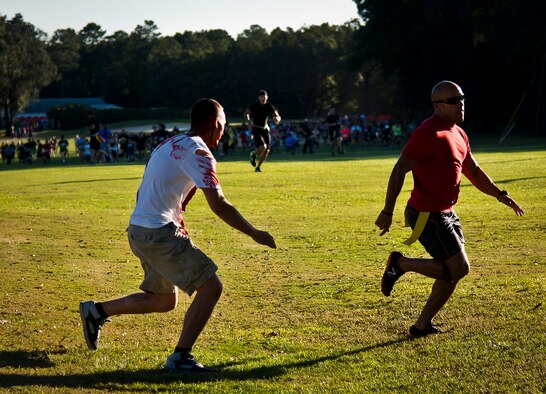 One of the first of many runners tries to escape a zombie attack at the beginning of the 2nd Annual Zombie Run Oct. 26 at the Eglin Air Force Base golf course.  More than 500 people attempted to outrun zombies and maneuver through various obstacles along the four-mile course.  (U.S. Air Force photo/Samuel King Jr.)