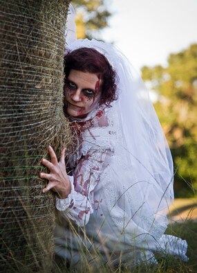 A zombie bride waits for the next group of runners during the 2nd Annual Zombie Run Oct. 26 at the Eglin Air Force Base golf course.  More than 500 people attempted to outrun zombies and maneuver through various obstacles along the four-mile course.  (U.S. Air Force photo/Samuel King Jr.)