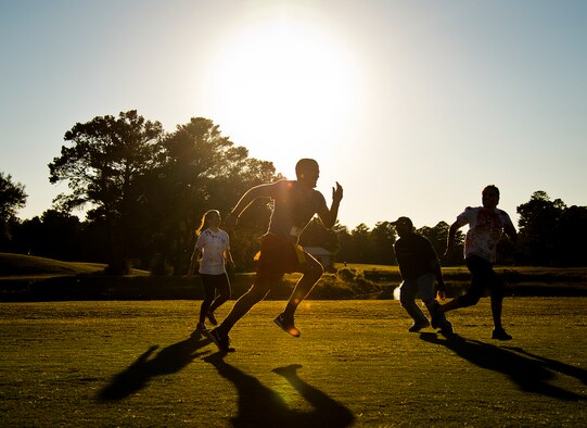 Zombies attack a runner midway through the 2nd Annual Zombie Run Oct. 26 at the Eglin Air Force Base golf course.  More than 500 people attempted to outrun zombies and maneuver through various obstacles along the four-mile course.  (U.S. Air Force photo/Samuel King Jr.)