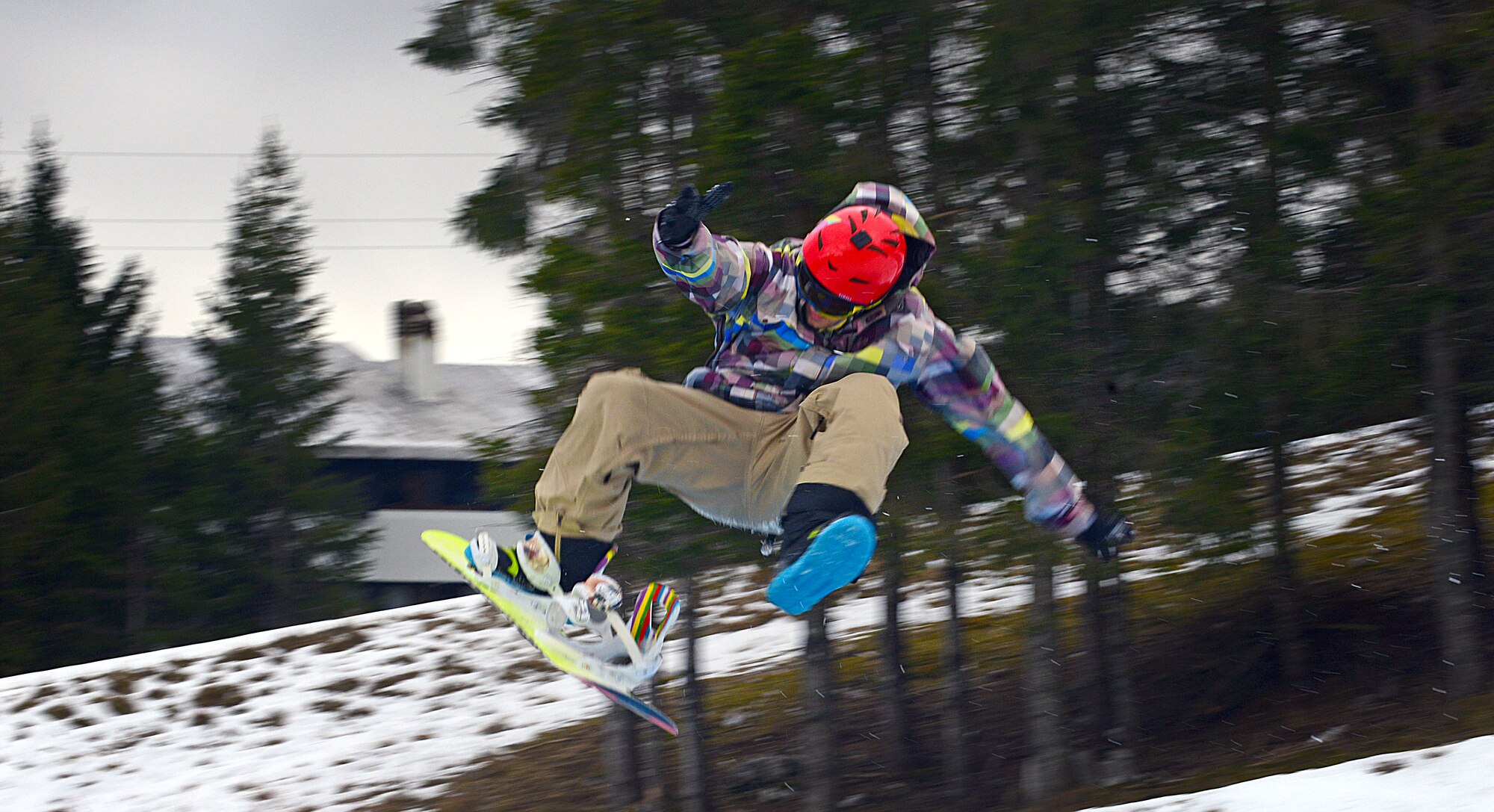 Senior Airman Aaron Bolster, 31st Aircraft Maintenance Squadron structural maintenance journeyman, does a trick on his snowboard, Jan. 12, 2013, at Piancavallo, Italy. The mountain located near Aviano Air Base offers more than 10 ski and snowboarding trails, an ice skating rink and a hill for snow tubing. (U.S. Air Force photo/Airman 1st Class Matthew Lotz)