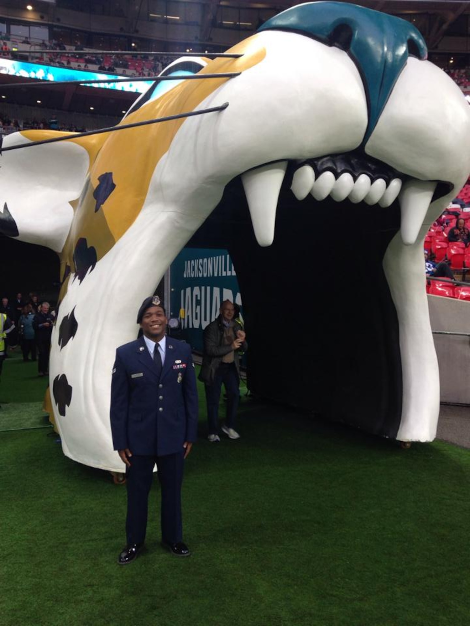 U.S. Air Force Airman 1st Class James Taylor, 100th Security Forces Squadron patrolman, poses for a photograph Oct. 27, 2013, prior to leading the National Football League’s Jacksonville Jaguars onto the field at Wembey Stadium in London, England. Taylor's leadership presented him with this surprise opportunity to represent the U.S. Air Force and his hometown NFL team.  The NFL gave Taylor and U.S. Air Force Airman Sara V. Summers, 48th Security Forces Squadron patrolman from RAF Lakenheath, the opportunity to lead rival football teams onto the field.  (Courtesy Photo from Angel Trejo)