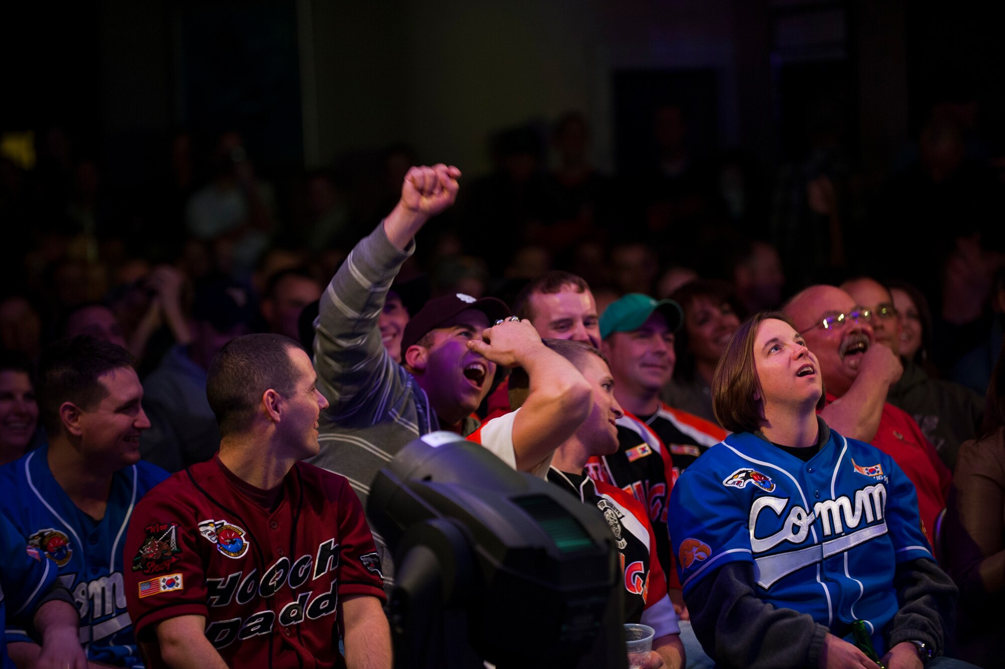 Members of the Wolf Pack watch a performance by Country music artist Aaron Tippin at Kunsan Air Base, Republic of Korea, Oct. 25, 2013. Tippin performed at several military bases around Korea in a tour sponsored by Armed Forces Entertainment and Stars for Stripes. (U.S. Air Force photo by Senior Airman Clayton Lenhardt/Released)