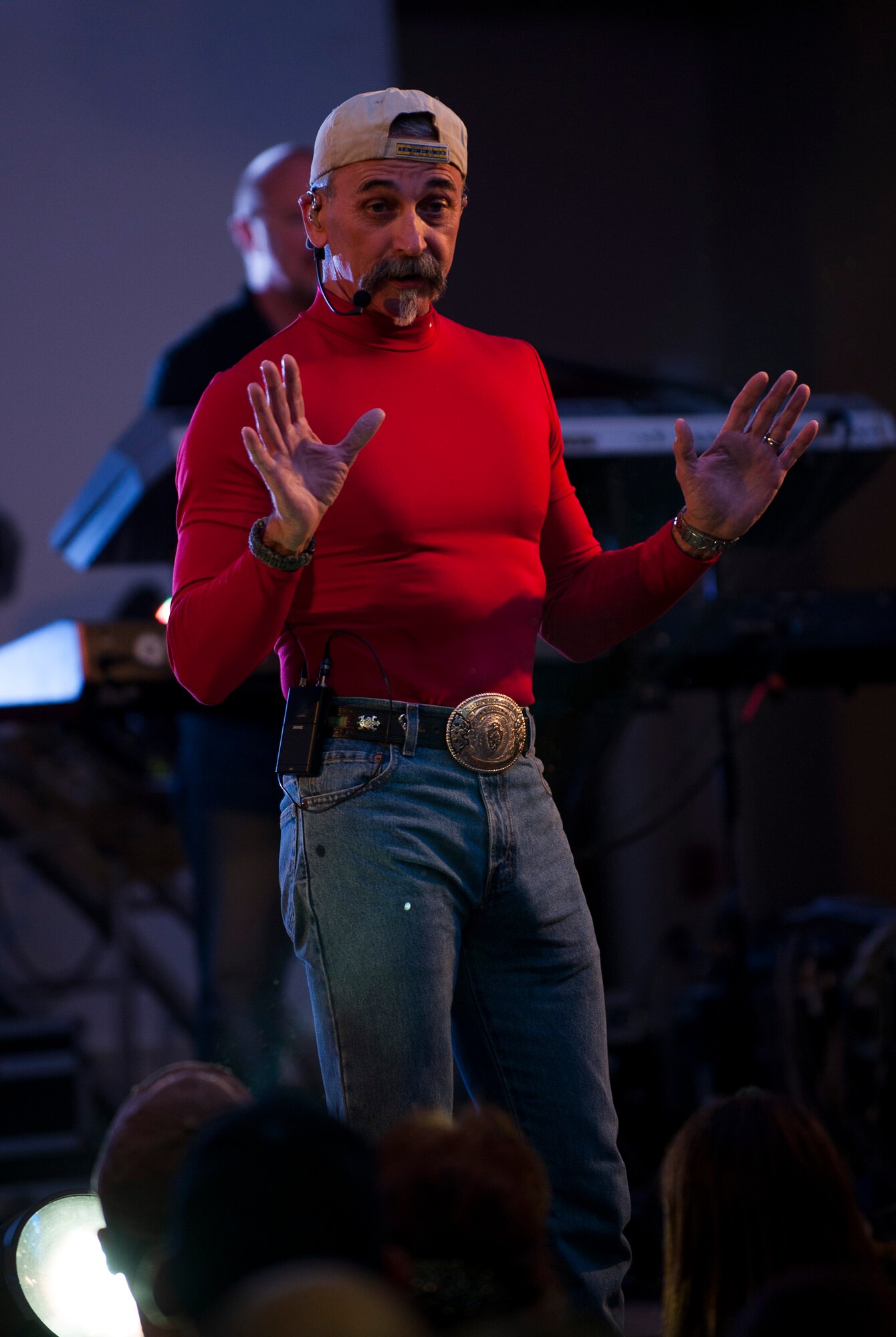 Country music artist Aaron Tippin shares a story during his perfomance at the Loring Club while visiting Kunsan Air Base, Republic of Korea, Oct. 25, 2013. Tippin performed at several military bases around Korea in a tour sponsored by Armed Forces Entertainment and Stars for Stripes. (U.S. Air Force photo by Senior Airman Clayton Lenhardt/Released)