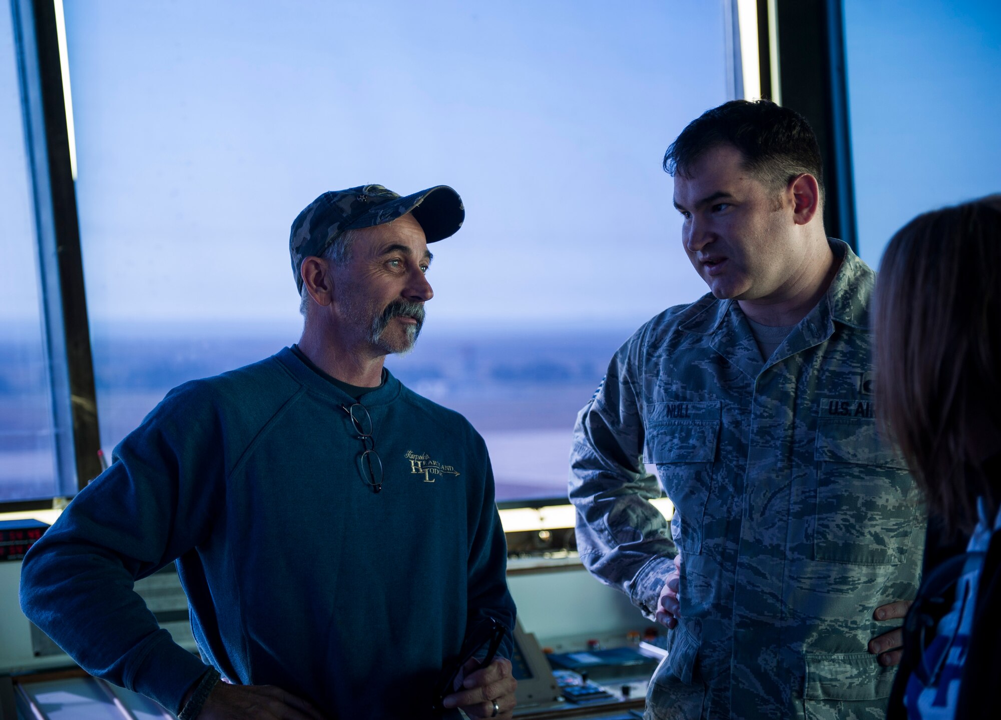 Tech Sgt. Gerald Null, 8th Operations Support Squadron, briefs country music artist Aaron Tippin on control tower operations during a tour at Kunsan Air Base, Republic of Korea, Oct. 25, 2013. Tippin performed at several military bases around Korea in a tour sponsored by Armed Forces Entertainment and Stars for Stripes. (U.S. Air Force photo by Senior Airman Clayton Lenhardt/Released)