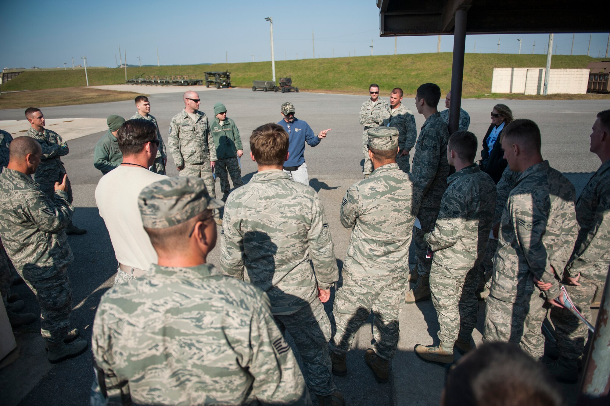 Country music artist Aaron Tippin thanks Airmen from the 8th Maintenance Squadron during a tour at Kunsan Air Base, Republic of Korea, Oct. 25, 2013. Tippin performed at several military bases around Korea in a tour sponsored by Armed Forces Entertainment and Stars for Stripes. (U.S. Air Force photo by Senior Airman Clayton Lenhardt/Released)