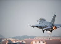A 35th Fighter Squadron F-16 Fighting Falcon takes off during Max Thunder 13-2 at Kunsan Air Base, Republic of Korea, Oct. 28, 2013. U.S. Air Force Airmen, U.S. Marines and Republic of Korea air forces kicked off Max Thunder 13-2 during the first go, or takeoff. This is the 11th Max Thunder exercise, which fosters bilateral aerial training between the Korea Air Power Team to include the U.S. Air Force, Marine Corps and the Republic of Korea air force.  (U.S. Air Force photo by Senior Airman Armando A. Schwier-Morales/Released)