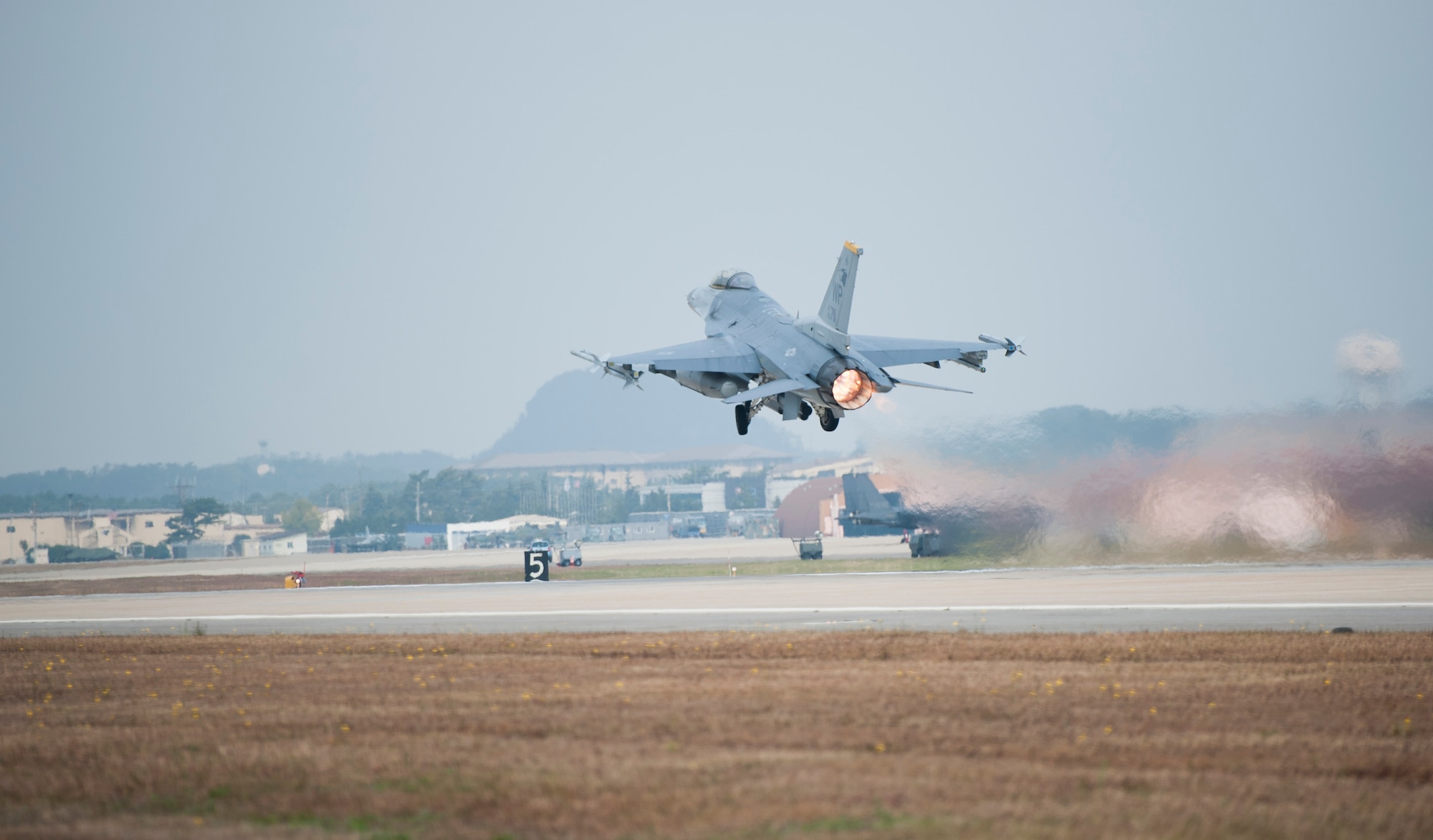 An 80th Fighter Squadron F-16 Fighting Falcon takes off during Max Thunder 13-2 at Kunsan Air Base, Republic of Korea, Oct. 28, 2013. U.S. Air Force Airmen, U.S. Marines and Republic of Korea air forces kicked off Max Thunder 13-2 during the first go, or takeoff. This is the 11th Max Thunder exercise, which fosters bilateral aerial training between the Korea Air Power Team to include the U.S. Air Force, Marine Corps and the Republic of Korea air force.  (U.S. Air Force photo by Senior Airman Armando A. Schwier-Morales/Released)