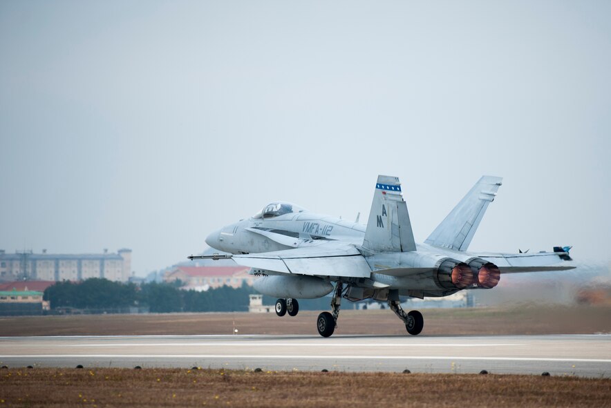 A U.S. Marine F-18 Hornet, from Iwakuni Marine Corps Air Station, Japan, takes off during Max Thunder 13-2 at Kunsan Air Base, Republic of Korea, Oct. 28, 2013. U.S. Air Force Airmen, U.S. Air Force Airmen, U.S. Marines and Republic of Korea air forces kicked off Max Thunder 13-2 during the first go, or takeoff. This is the 11th Max Thunder exercise, which fosters bilateral aerial training between the Korea Air Power Team to include the U.S. Air Force, Marine Corps and the Republic of Korea air force. (U.S. Air Force photo by Senior Airman Armando A. Schwier-Morales/Released)
