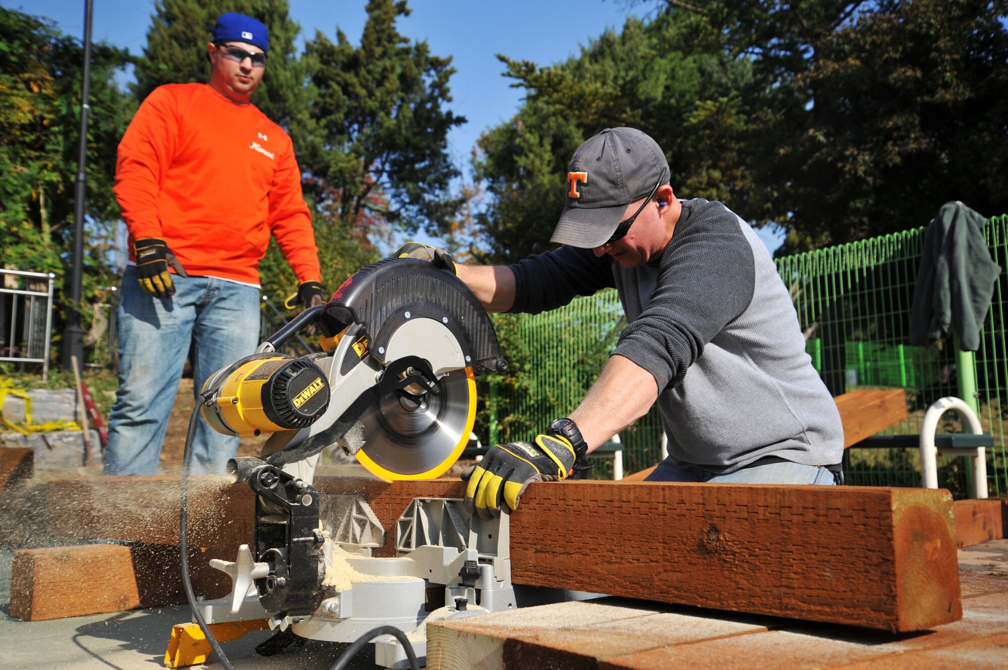 Tech. Sgt. Justin McGovern, 51st Civil Engineer Squadron structural craftsman, makes new steps for the Mustang Valley Park at Osan Air Base, Republic of Korea, Oct. 26, 2013. The 51st CES provided all the tools and equipment for volunteers to use during the clean-up. (U.S. Air Force photo/Staff Sgt. Emerson Nuñez)