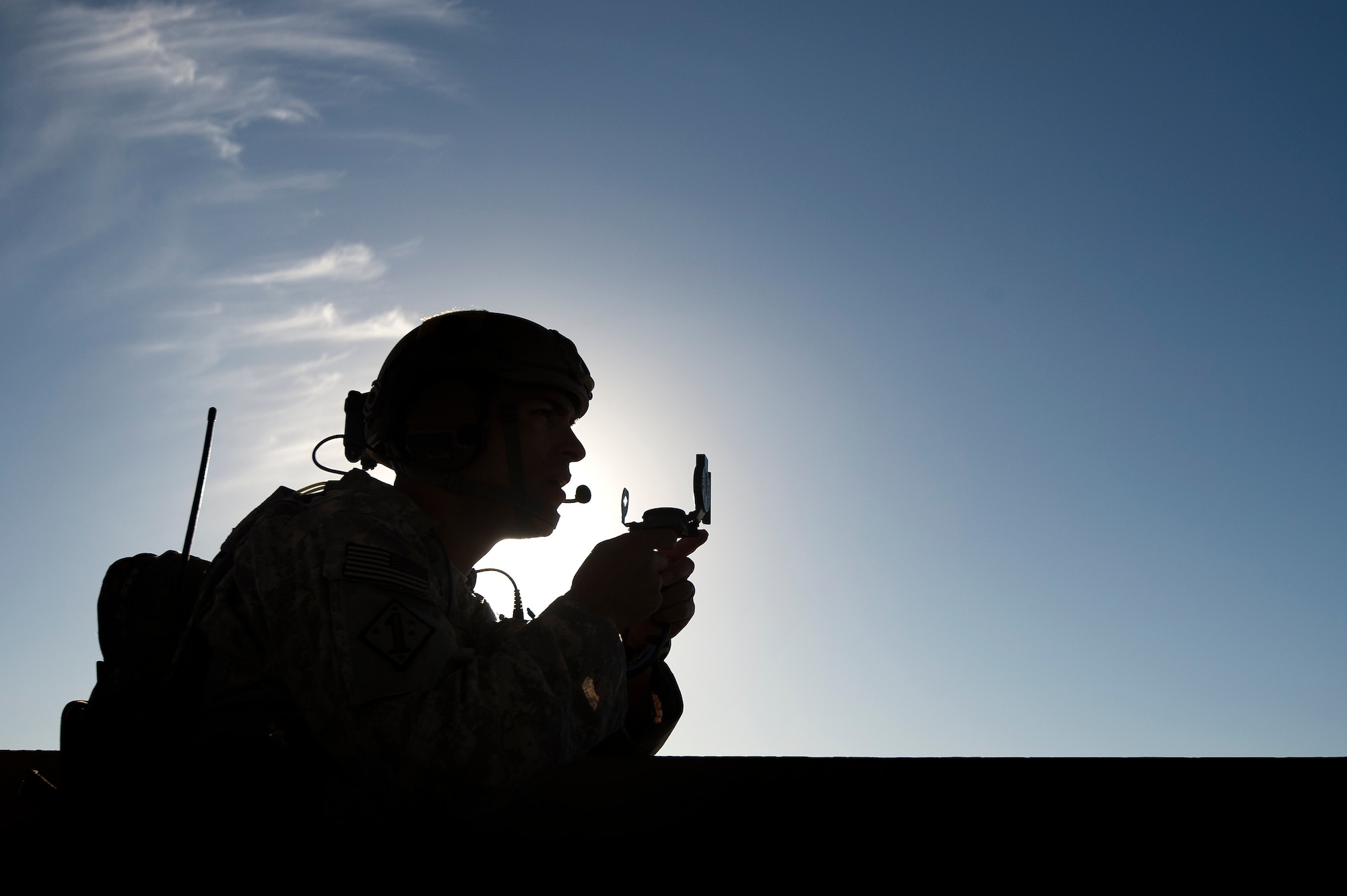 Tech. Sgt. Alberto Cervantes, 82nd Expeditionary Air Support Operations Squadron joint terminal attack controller, checks a target position during a joint live-fire exercise Oct. 23, 2013, at a regional range in Southwest Asia. The 82nd EASOS provides air-to-ground JTAC and weather expertise to the U.S. Army Central Task Force. Cervantes, hailing from Georgetown, Texas, is deployed from Fort Hood, Texas. (U.S. Air Force Photo/Master Sgt. Ben Bloker)
