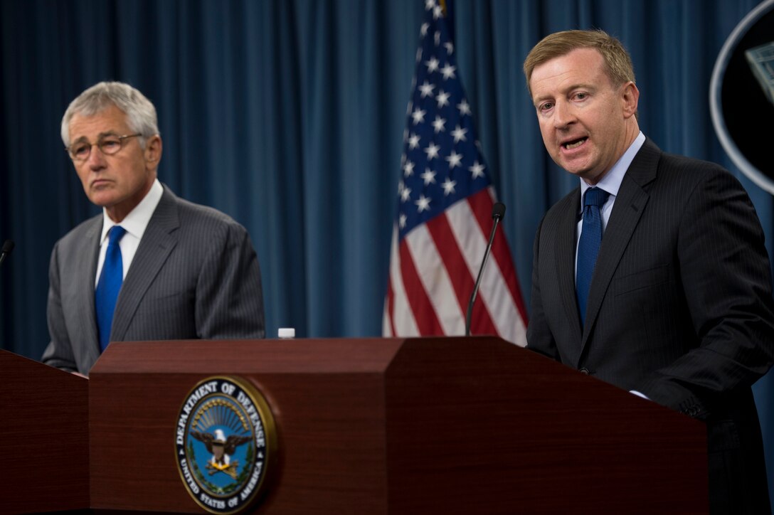 New Zealand Defense Minister Jonathan Coleman, right, answers a reporter’s question during a joint press conference with U.S. Defense Secretary Chuck Hagel at the Pentagon, Oct. 28, 2013.
