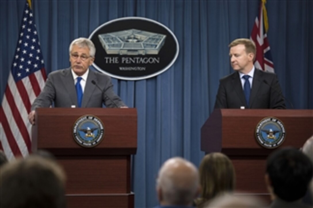 Secretary of Defense Chuck Hagel, left, answers a reporter’s question during a joint press conference with New Zealand Minister of Defense Jonathan Coleman in the Pentagon in Arlington, Va., on Oct. 28, 2013.  Hagel and Coleman met earlier to discuss national and regional security items of interest to both nations.  