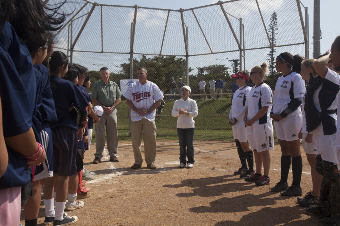 Lt. Gen. John E. Wissler and Brig. Gen. Niel E. Nelson share words of encouragement with members of Team Urasoe and Ryukyu Ruckus Oct. 26 following a softball game at Camp Kinser. “It’s a good thing (the game) ended in a tie,” said Wissler. “This way everybody wins. (Everyone) came out to play and have a good time, and I can see we did that. Days like this one give us a chance to continue our fulfilling relationship (with the local community), and I hope there are many more days like (it).” Wissler is the commanding general of III Marine Expeditionary Force, and Nelson is the commanding general of 3rd Marine Logistics Group, III MEF