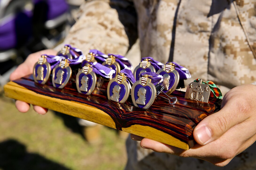 The awards being presented to the Marines and sailor with Fox Company, 2nd Battalion, 2nd Marine Regiment, in support of Operation Enduring Freedom Oct. 24, 2013.  (Official U.S. Marine Corps photo by Lance Cpl. Michael C. Dye)