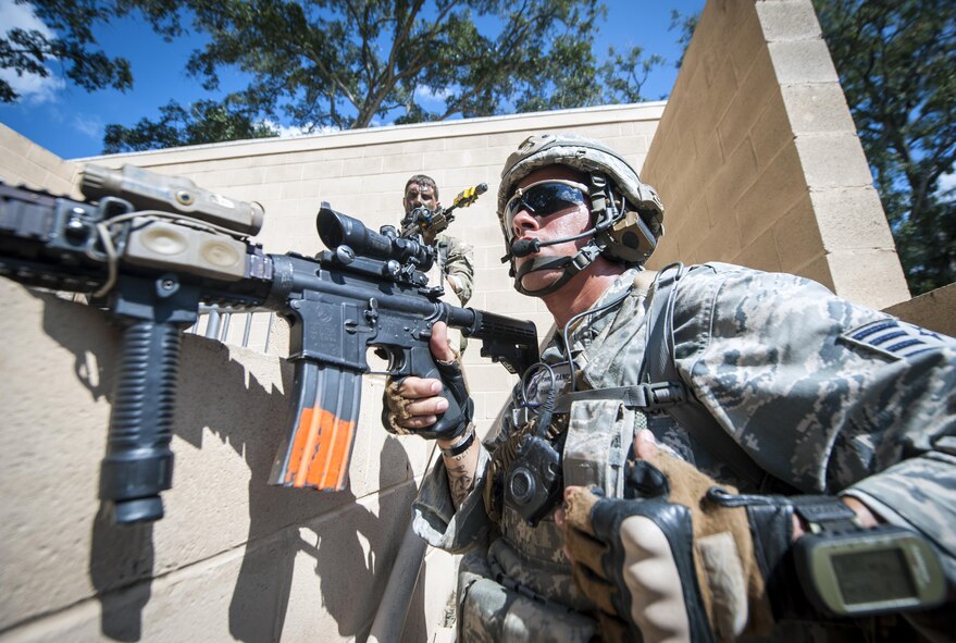 Staff Sgt. Pablo Cancel keeps a lookout at the military operations in urban terrain, or MOUT, village during Exercise Global Eagle Oct. 17, 2013, at Moody Air Force Base, Ga. The training scenario stimulated scenarios U.S. Air Force and Royal Air Force airmen may face while deployed. Cancel is assigned to the 822nd Base Defense Squadron. 