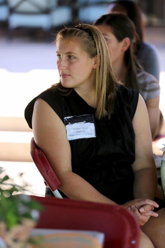 Kimberly Reed, a volunteer with Marine Aircraft Group 11, listens as the First Lady of the Marine Corps, Bonnie Amos, shares experiences during a luncheon honoring military spouses aboard Marine Corps Air Station Miramar, Calif., Oct. 18. Maj. Gen. Steven Busby, 3rd Marine Aircraft Wing commanding general, and his wife, Cindy Busby, hosted the event at their home as part of his Committed and Engaged Spouse Campaign.