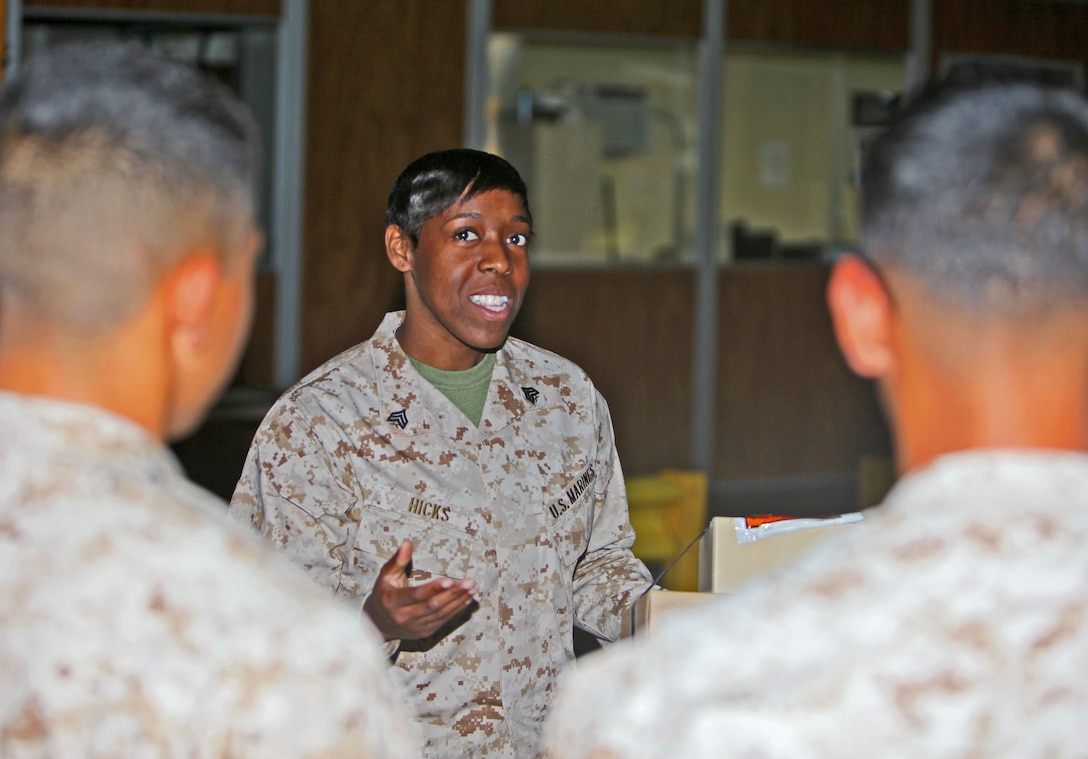 Sergeant Krystal Hicks, training noncommissioned officer, 1st Supply Battalion, Combat Logistics Regiment 15, 1st Marine Logistics Group, explains the importance of ensuring the proper equipment is packaged and sent to the proper place, aboard Camp Pendleton, Calif., Oct. 24, 2013. Hicks won her regiment's meritorious sergeant board on July 24, 2013, and dedicates her time to improving her Marines' careers. 