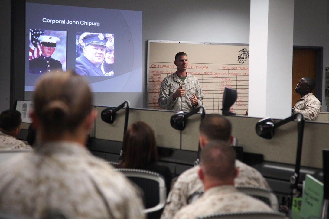 Warrant Officer Matthew Pfarr, the pay and separations quality insurance officer for Service Company, Combat Logistics Regiment 17, 1st Marine Logistics Group, gives a guided discussion during a Beirut bombing memorial aboard camp Pendleton, Calif., Oct 23, 2013. During the memorial, Marines reflected on those who lost their lives in Beirut, Lebanon, 30 years ago and watched and discussed a video about the attacks. 