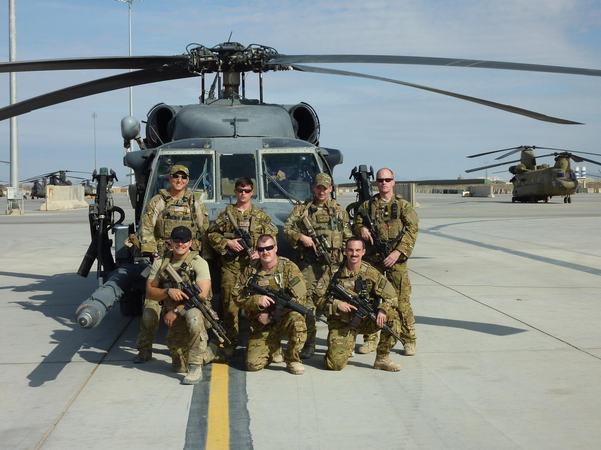 Capt. Charles C. Napier, bottom right, poses with his team members while deployed to Afghanistan. Napier earned the Distinguished Flying Cross for his heroic actions in Afghanistan in December 2012. 