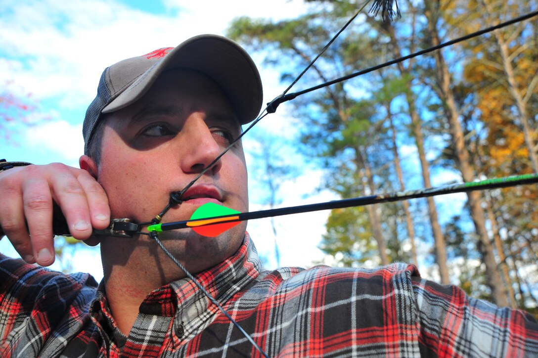 Travis Sullivan, 30, Barneveld, Wis. prepares to fire an arrow down range on Oct. 23, 2013 at the Quantico Archery Site aboard Marine Corps Base Quantico.
The Quantico Archery Site was constructed in 2008 by the Conservational Volunteer Program. 