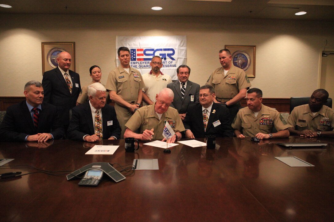 NEW ORLEANS – Lt. Gen. Richard P. Mills, commander of Marine Forces Reserve and Marine Forces North, signs a statement of support for the Guard and Reserve at the Marine Corps Support Facility, Oct. 29. The statement signifies the commander’s intent to assist Marines and sailors with their careers, supporting the mission of the Employer Support of the Guard and Reserve. ESGR aims to gain and maintain civilian employer support for Guardsmen and Reserve members by rewarding outstanding support from civilian employers, educating service members and employers of their rights and obligations under the law, as well as resolving conflict through mediation. (U.S. Marine Corps photo by Lance Cpl. Tiffany Edwards)