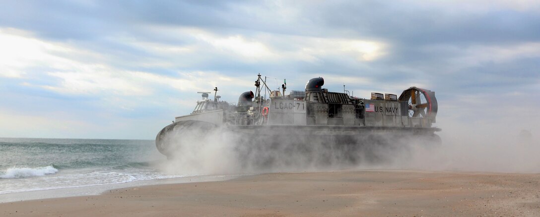 A U.S. Navy landing craft, air cushion transports 22nd Marine Expeditionary Unit (MEU) equipment at Marine Corps Base Camp Lejeune, N.C., Oct. 25, 2013. The 22nd MEU and Bataan Amphibious Ready Group (ARG) are conducting the ARG/MEU Exercise, or ARG/MEU Ex, off the East Coast through mid-November. The MEU is scheduled to deploy in early 2014 to the U.S. 5th and 6th Fleet areas of responsibility with the Bataan ARG as a sea-based, expeditionary crisis response force capable of conducting amphibious missions across the full range of military operations. (U.S. Marine Corps photo by Lance Cpl. Caleb McDonald/Released)