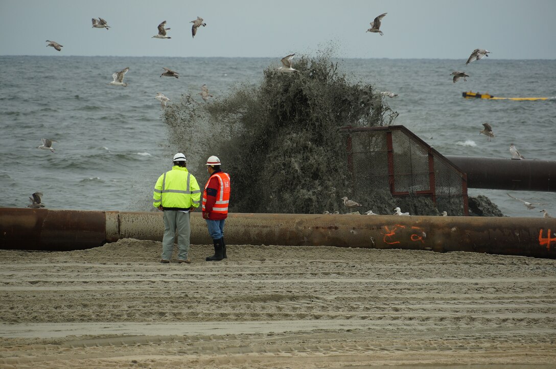 A slurry of sand and water is pumped from a nearby dredge onto Monmouth Beach during the U.S. Army Corps of Engineers' ongoing beach renourishment work in Monmouth Beach, N.J., Thursday July 25, 2013.

The U.S. Army Corps of Engineers is repairing and restoring previously constructed coastal projects like the Sea Bright to Manasquan project. The work at Monmouth Beach is part of the Sea Bright to Monmouth Beach contract, which is one of four contracts that will be awarded to repair and restore beaches from Sea Bright to Manasquan in northern New Jersey. 