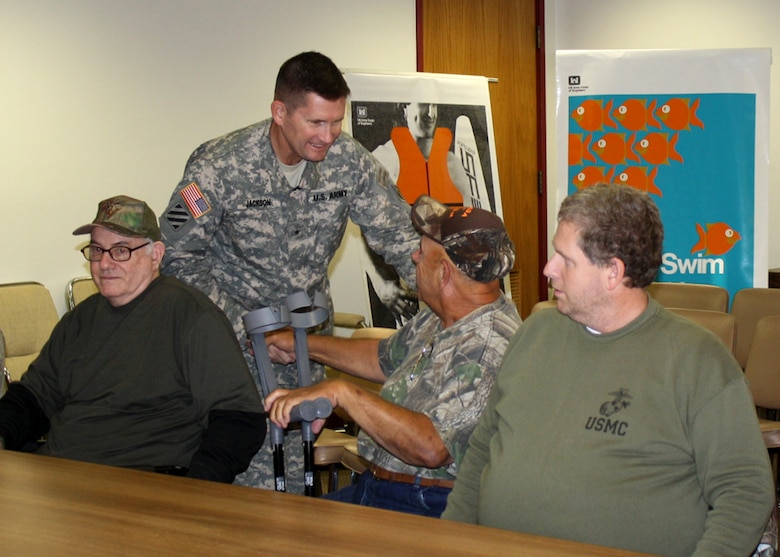 USACE South Atlantic Division Commander Brig. Gen. Donald E. (Ed) Jackson shakes hands with members of the Paralyzed Veterans of America Southeastern chapter at Richard B. Russell Lake, Oct. 23, 2013.