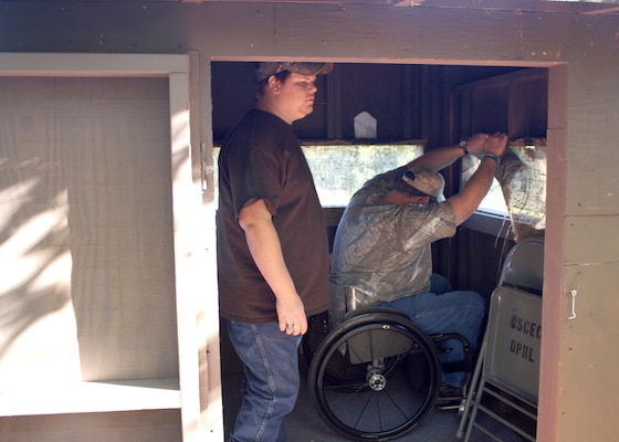 PVA member Tommy and his son Max get ready to hunt from a wheelchair accessible hunting blind at the U.S. Army Corps of Engineers Richard B. Russell Lake.

